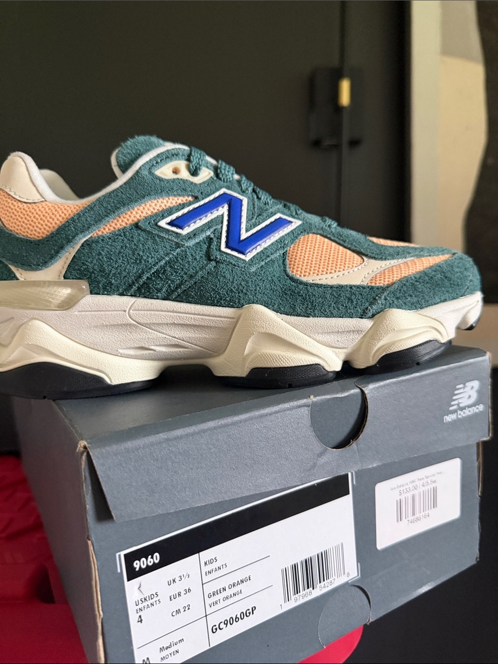 New Balance kids Athletic Sneaker with Blue Logo